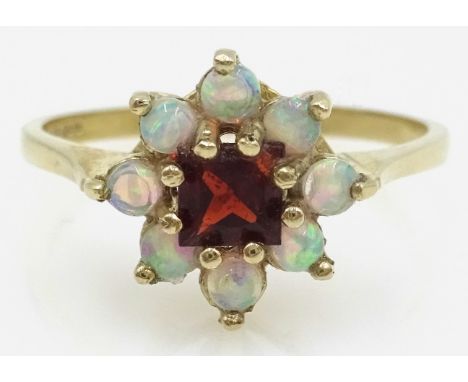 9ct gold garnet and opal cluster ring hallmarked   Condition Report Size Q - R, approx 2gmClick here for further images, cond