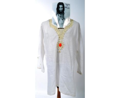 From the collection of Valerie Leon - a vintage Kurtis designed ladies linen summer tunic top in white, with a decorative fau