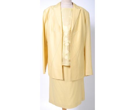 From the collection of Angela Grant - Miss V - Valentino - a yellow three piece ladies suit, comprising blouse, skirt and jac