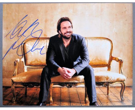 Alfie Boe - English Singer and Actor - autographed 8x10" colour photograph of Boe in a relaxed pose. Signed neatly in black i