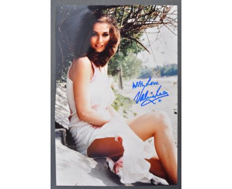 From the collection of Valerie Leon - a full colour 7x10" (approx) publicity photograph of Ms Leon on a beach. Autographed by
