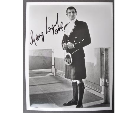 James Bond 007 - George Lazenby - On Her Majesty's Secret Service - an impressive signed 8x10" black and white photograph fro