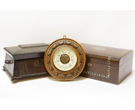 A 19th century mahogany sarcophagus work box, standing on short feet, together with a further work box, the largest 30cm wide