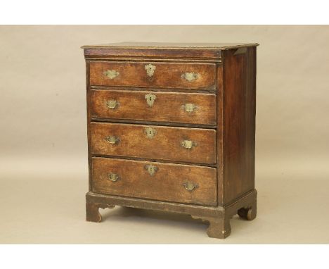 An 18th century oak country made chest of four graduated drawers, brass handles, on bracket feet, 90 x 103 x 49cm