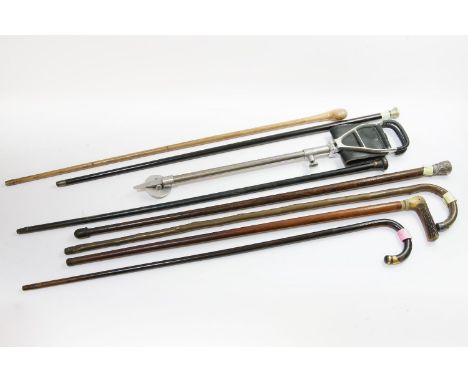 An Asian white metal mounted walking stick, and others