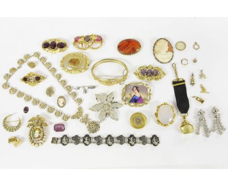 A collection of Victorian gilt metal jewellery, to include a Victorian gilt metal hinge bangle, set with red and white paste 