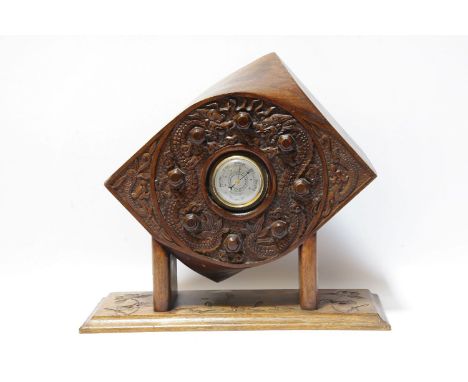 A WW1 trench art RFC Propeller Boss barometer with carved oriental decorations of  fighting dragons
