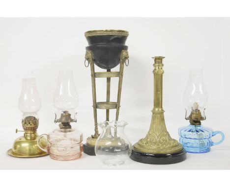 A collection of oil lamps, and oil lamp stands, etc