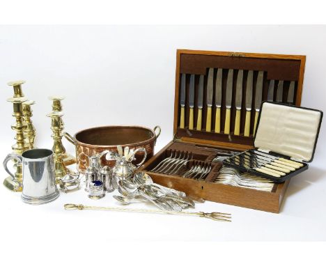 An oak cased canteen, a silver milk jug, cream jug, mustard spoons, a mustard, silver plated flatware, and brass candlesticks