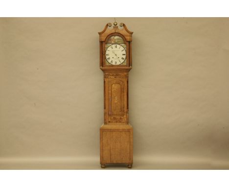 A George III oak and mahogany longcase clock, with a Black Forest movement, the painted arched dial inscribed, 'Waldfogel Her