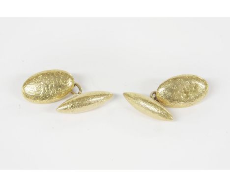 A pair of early 20th century gold oval head cufflinks, with torpedo back and engraved floral design, marked 157.41g