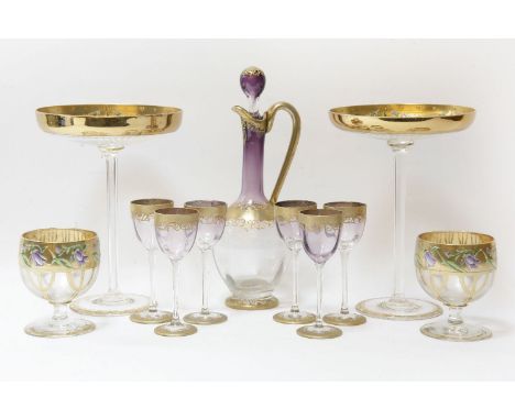 A pair of early 20th century Bohemian gilded and enamelled glass tazzas, together with a similar decanter, six lighter glasse