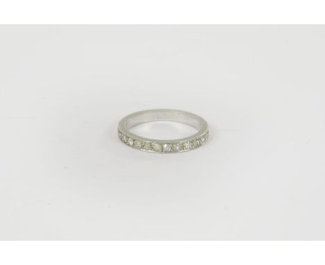 A platinum diamond half eternity ring, (tested  approximately as platinum), misshapen so approximate ring size K 4.14g