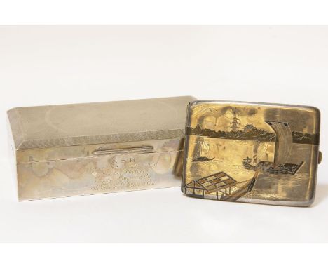 A silver cigarette box and case