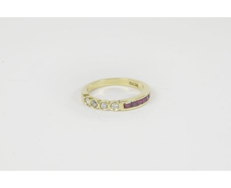 An Egyptian gold diamond and ruby half eternity ring, four spitch set brilliant cut diamonds to a row of channel set baguette