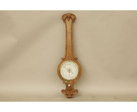 A Victorian rosewood wheel barometer, 91cm high, a Chinese export lacquered box, the interior with fitted trays and lidded bo