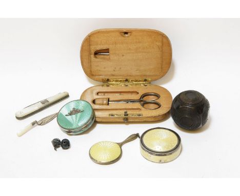 Two silver and enamel compacts, and a Victorian needlework kit in a wooden case