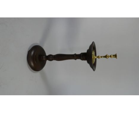 An Early 19th Century Oak Candle Stand with a Dished Top Supported on a Turned Column and Base with a Georgian Brass Candlest