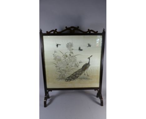 An Edwardian Mahogany Framed Fire Screen Containing Earlier Oriental Silk Embroidery Panel Depicting Peacock, Butterflies and