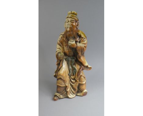 An Oriental Ceramic Glazed Study of an Immortal. Missing Stick and One Foot, Hand Glued. 38cms Tall