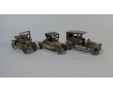 A Collection of Three Continental Silver Models of Vintage Cars 