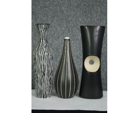 A vintage Midwinter art vase along with two other similar vases. H.26cm. (largest). 