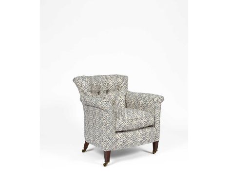 A Howard &amp; Sons tub armchair, recently re-upholstered, the curved button back above a loose cushion seat with scroll arms
