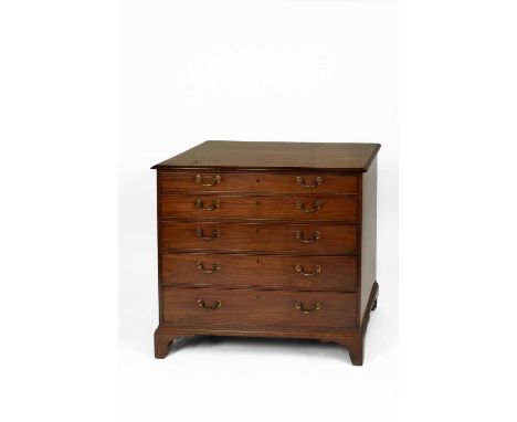 A George III mahogany secretaire chest of drawers, the rectangular top above five long drawers, the third drawer down a secre