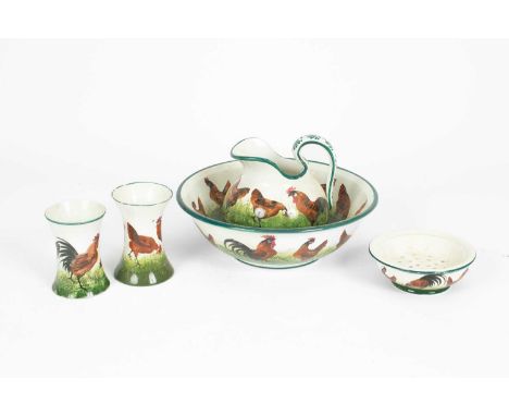 A Wemyss bathroom set, decorated with chickens comprising jug and basin, soap dish and two waisted vases, most with retailers