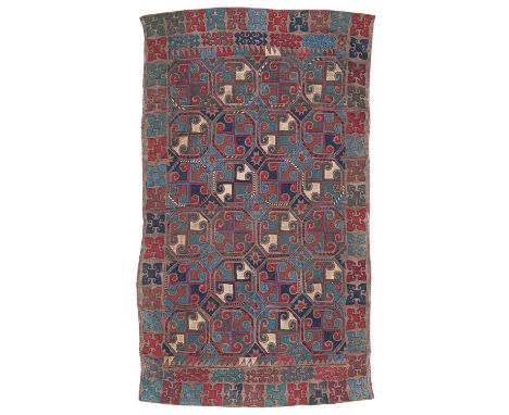 A Lakai embroidered Suzani kilim Uzbekistan, woven in eight strips with polychrome relief embroidery, the deep camel field wi