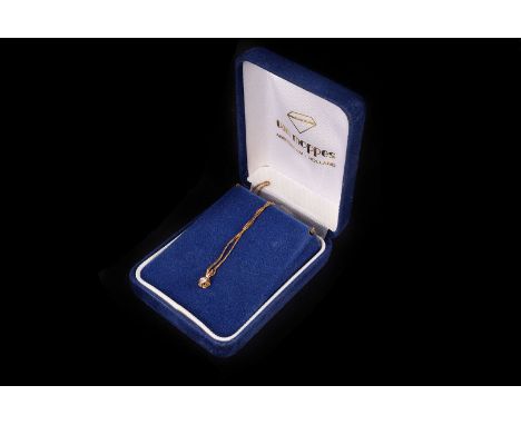 A diamond flower pendant,  the brilliant cut of approx .07ct, on a fine link chain, in box with certificate