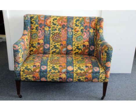 A 1950s French upholstered sofa, with high back, on four supports, one damaged