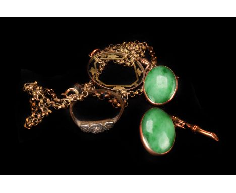 A pair of Chinese jade cuff links,  the oval links gold mounted, tamped with maker 'TH', to a 'bamboo' T-bar, together with a