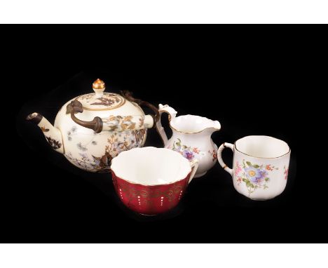 A Japanese part tea service in black and gold, consisting of 5 cups 6 saucers and teapot together with a further teapot with 