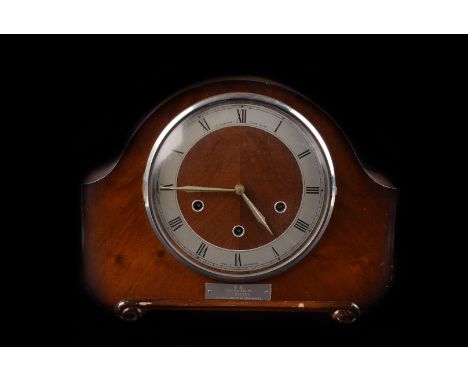 A group of five Art Deco and later wooden cased clocks, including four mantle examples and one wall clock, some appear to run