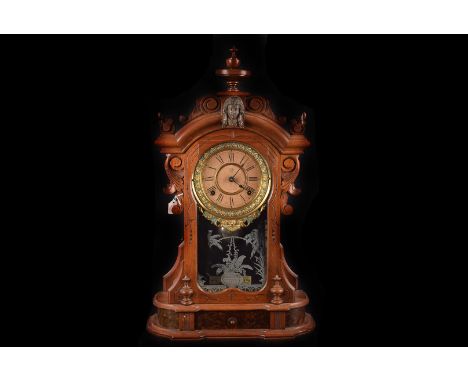 An Ansonia Mantle Clock in mahogany case with inset drawer,  paper dial and  brass surround, original glass with silver appli