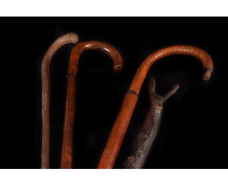 Two vintage shooting sticks, together with 3 walking sticks 2 riding whips and a mahogany book trough (parcel). 