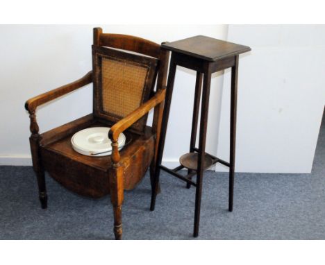 An Edwardian period commode chair, with lifting rattan seat enclosing a stoneware covered chamber pot, together with a simila