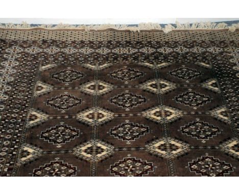 A 20th century Persian carpet, approx 187cm wide, with light brown ground and mulitple medallions