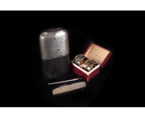 A Millennium silver pen knife by CCP,  together with a brass nut cracker in the form of a dog, a brass toasting fork, two ele