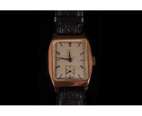 A 1930s 9ct gold mid-size wristwatch,  with 15 jewel manual wind movement, on a black leather strap 