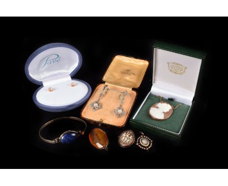 A collection of silver and costume jewellery,  including two carnelian bead necklaces, a Baltic amber brooch, and other resin