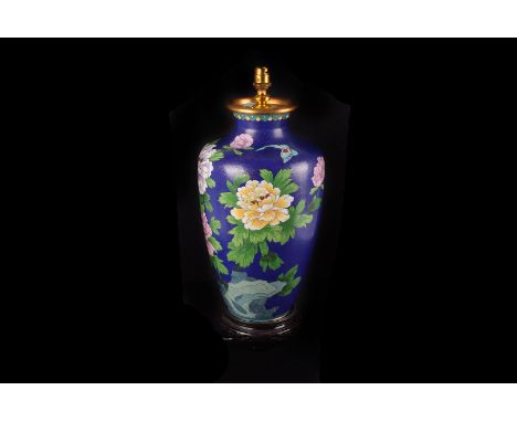 A mid 20th century Chinese cloisonné lamp base, with blue ground and flowers, dented, in card box (2)