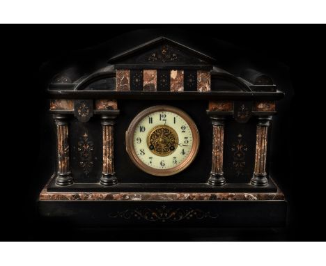 A late 19th century slate and marble mantle clock, with eight day cylinder movement , striking on a coil, 34cm high