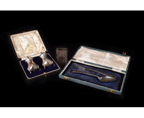 A cased pair of George V silver peppers from Elkington & Co, together with a silver matchbox holder and a silver Christening 