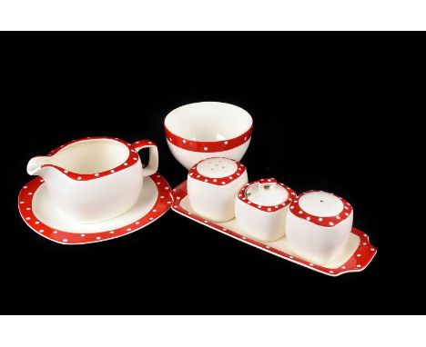 A Part Midwinter Polka Dot Dinner Service, with red borders and white polka dots,  consisting of 1 serving plate, 6 dinner pl