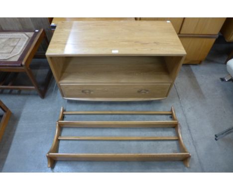 An Ercol Blonde elm TV unit and matching plate rack 