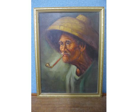 A portrait of an oriental man, oil on board, framed 