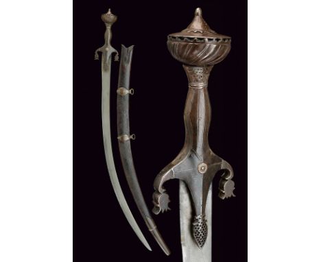 dating: 19th Century provenance: Indopersia Flat, single-edged, Shamshir blade of fine, Persian damask; iron hilt, pierced la