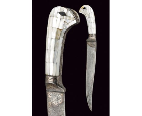 dating: Second part of the 20th Century provenance: Indopersia Curved, single-edged blade with damask structure, decorated wi